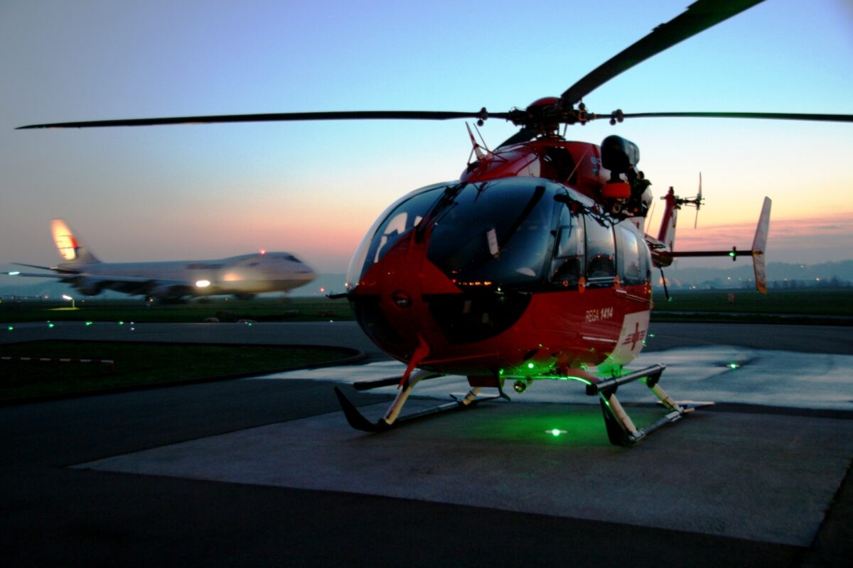 helipad with helicopter and 747 on the background