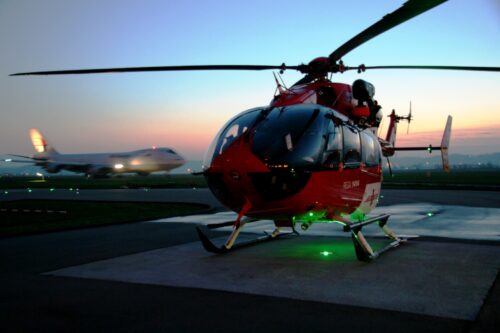 helipad with helicopter and 747 on the background