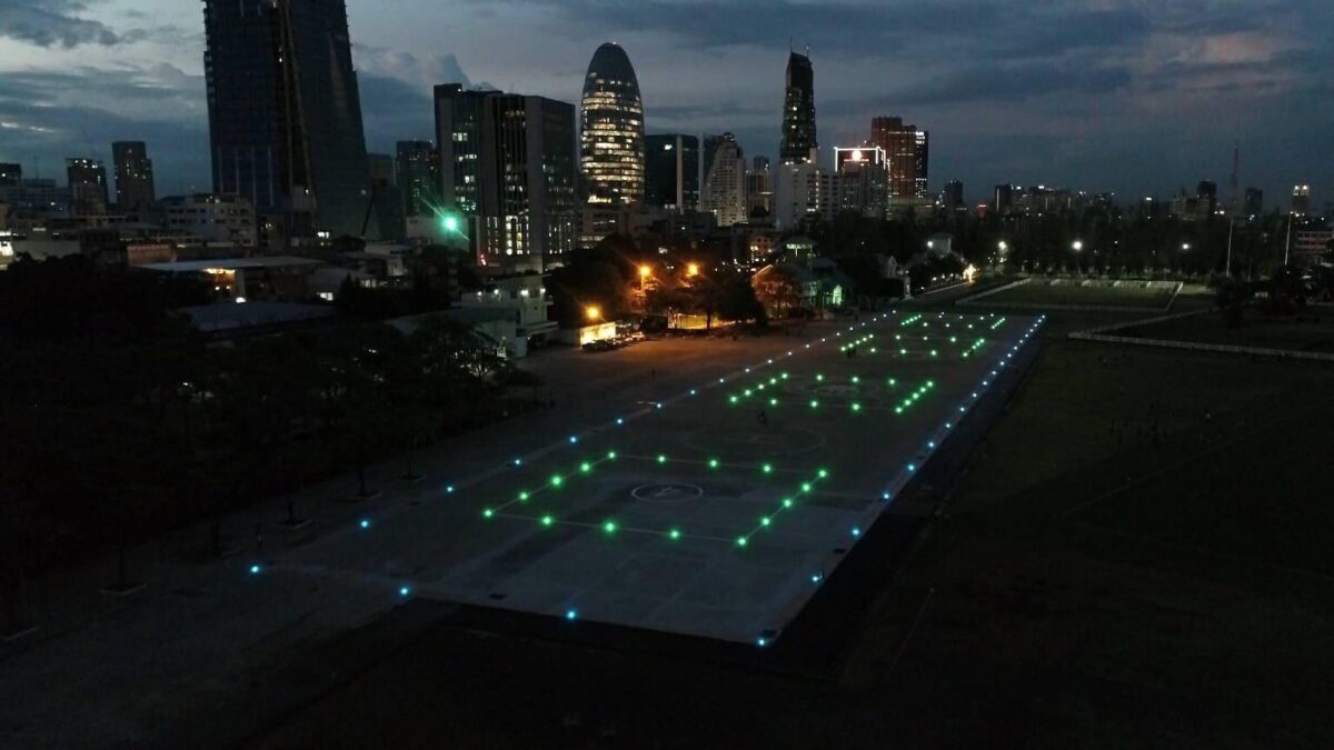 helipad with 4 TLOF Llighted next to a city