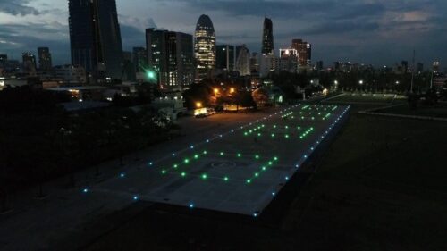 helipad with 4 TLOF Llighted next to a city